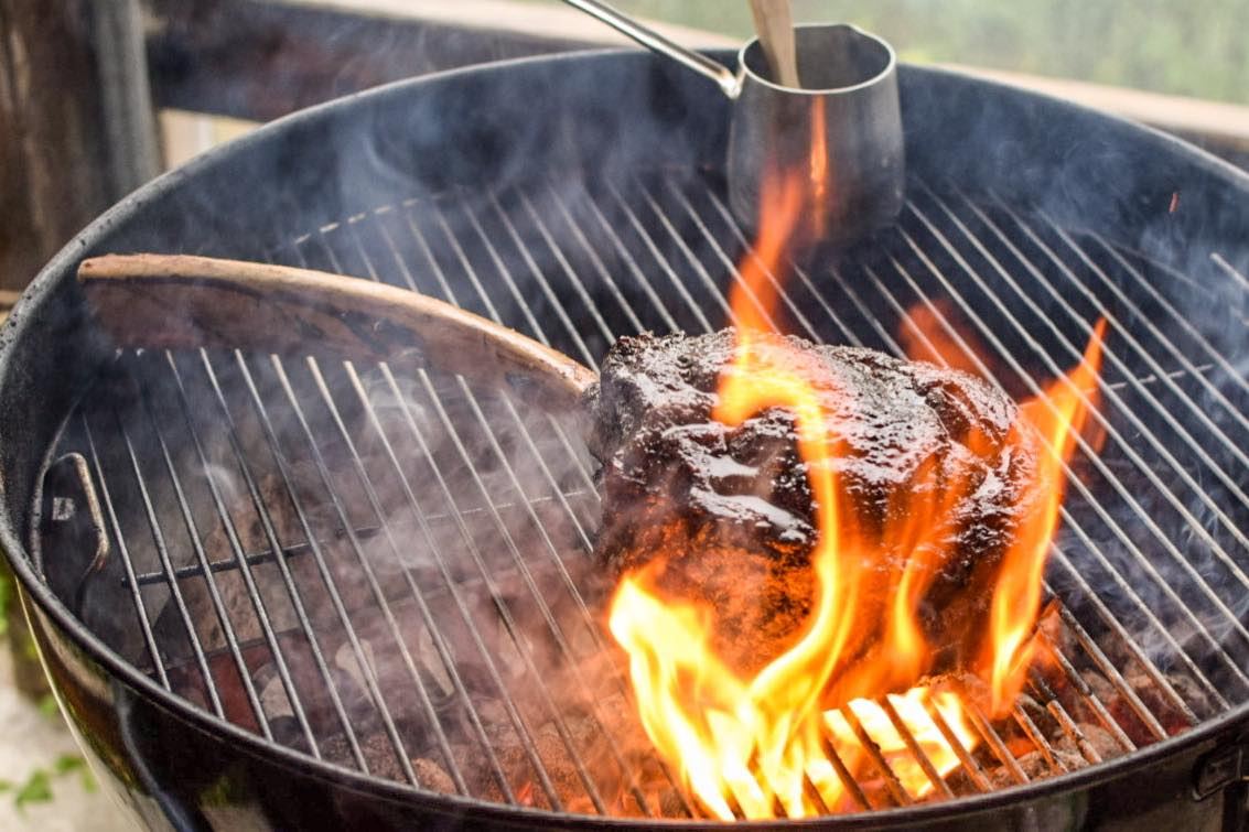 Meat catching flame directly on hot coals